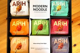 A display of packaged modern noodles with various flavors labeled Arih