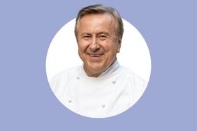 Daniel Boulud smiling and wearing a chefs coat