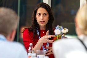 Anna Polonsky leading a roundtable discussion with restaurateurs and hospitality industry professionals.