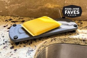 A sponge rests on a sink caddy 