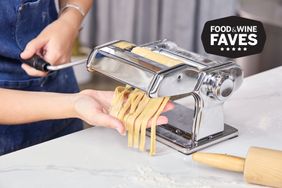 Cut pasta coming out of the Marcato Atlas 150 Pasta Machine