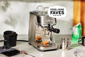 Breville Bambino Plus Expresso Machine on top of a gray kitchen counter