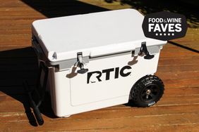 The RTIC 52-quart Ultra Light Wheeled Hard Cooler on a deck during best coolers with wheels tests