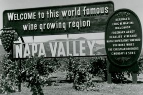 Napa Valley sign welcoming visitors to the winegrowing region featuring the names of several wineries