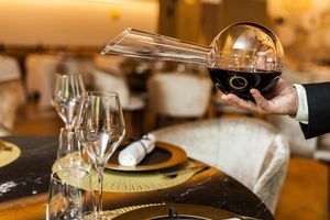 Wine being poured from a decanter.