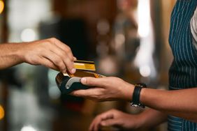 A person pays the bill at a restaurant