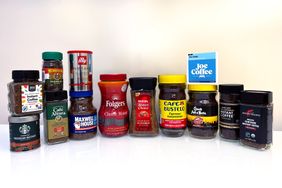 A variety of instant coffee brands displayed in jars and containers