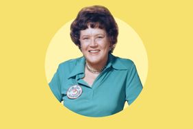 Julia Child smiling wearing a teal shirt