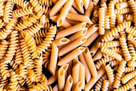 Closeup of rotini and penne pasta mixed together