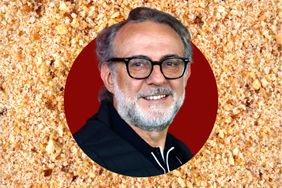 Massimo Bottura smiling in front of a textured background