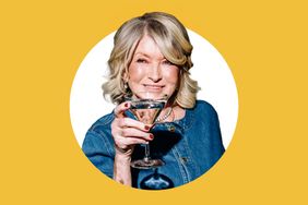 Martha Stewart holding a cocktail glass