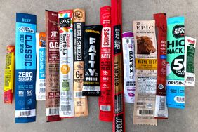 A selection of packaged meat sticks arranged on a flat surface