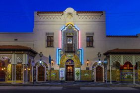 The exterior of Columbia Restaurant at twilight.