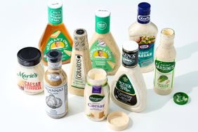A selection of Caesar salad dressing bottles arranged together representing various storebought brands