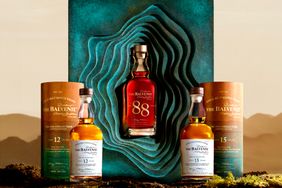 Three The Balvenie whiskey bottles prominently displayed with their respective boxes including the 88 year old expression in the center