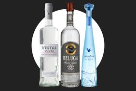 Three vodkas in bottles Vestal Beluga and Grey Goose Altus arranged with a circle background