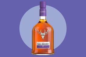 The Dalmore 17yearold whisky bottle with a stag emblem on the label set against a purple background