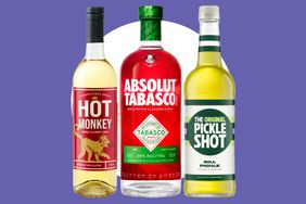 Three bottles of uniquely flavored vodkas labeled as Hot Monkey Absolut Tabasco and The Original Pickle Shot displayed on a purple background