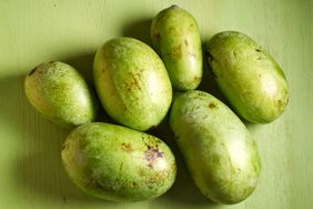 Group of pawpaw fruits on a green surface