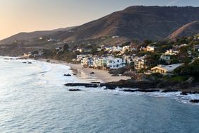 Aerial drone still of private houses on the Pacific Ocean coastline in Malibu, California.