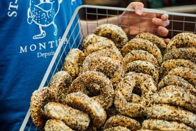 A person holding a basket of bagels from St. Viateur Bagel in Montreal.