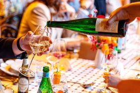 Wine being poured at The Food & Wine Classic in Aspen.